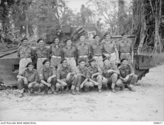 Group portrait of the personnel of No. 5 Troop, A Squadron, 2/4th Armoured Regiment. Left to right, back row: SX17804 Trooper (Tpr) D H Glazbrook of Minlayton, SA; NX82319 Tpr R King of North ..