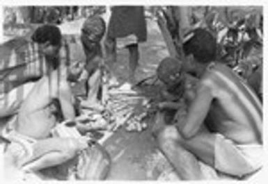 Tome Arika and others selling betel nut, areca