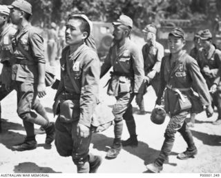 THE SOLOMON ISLANDS, 1945-09-19. SOME JAPANESE TROOPS FROM NAURU ISLAND ON THEIR WAY TO INTERNMENT ON BOUGAINVILLE ISLAND. (RNZAF OFFICIAL PHOTOGRAPH.)