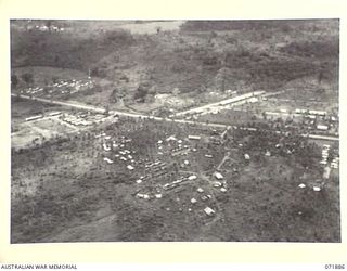 LAE, NEW GUINEA. 1944-03-30. AN AERIAL VIEW SHOWING THE WORKS COMPANY, THE BASE SUPPLY DEPOT, AND THE FORTRESS WORKSHOP