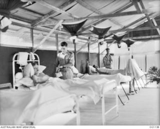 NADZAB, NEW GUINEA. 1944-05-09. CORPORAL (CPL) BERT FRY AND CPL R. BOARDEN, BOTH OF SYDNEY, NSW, TENT PATIENTS IN THE NEAT HOSPITAL WARDS OF NO. 23 MEDICAL CLEARING STATION RAAF