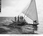 Natives and members of resurvey party in a canoe, Rongerik Island, summer 1947