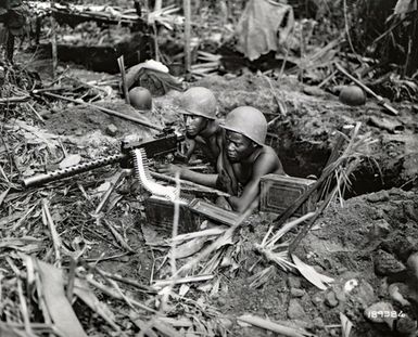 Members of the 93rd Infantry Division Man Machinegun on the Numa-Numa Trail