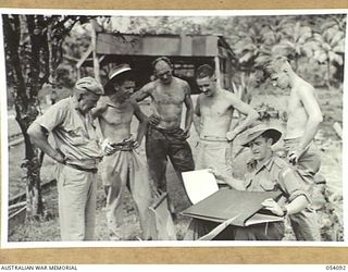 BALASANA, NEW GUINEA, 1943-07-06. SERGEANT G. R. MAINWARING, WAR ARTIST OF MILITARY HISTORY SECTION AT THE 1ST AUSTRALIAN WATER TRANSPORT GROUP (SMALL CRAFT) MAINTENANCE BASE