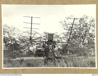 PORT MORESBY, NEW GUINEA. 1943-12-16. FRONT VIEW OF THE SEARCHLIGHT CONTROL SITE TESTING EQUIPMENT AT THE HEAVY ANTI-AIRCRAFT GUN SITE, H.8 AT THE ROYAL AUSTRALIAN ARTILLERY, SHOWING TRANSMITTING ..