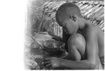 Boy with wooden bowl