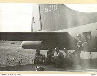 Papua, New Guinea. 1942-08. Crew of an American Boeing B17 Flying Fortress aircraft waiting to take off on a supply-dropping mission over the forward area
