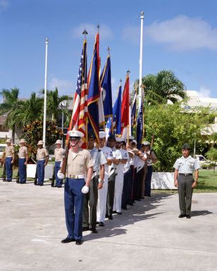 A joint services color guard participates in a Veteran's Day memorial service at the Tomb of the Unknown Soldier, located in Skinner Plaza