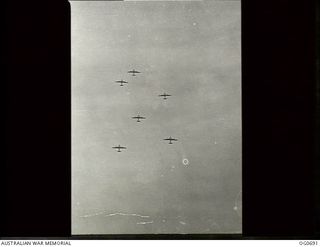 NADZAB, NEW GUINEA. C. 1944-02. B-24 LIBERATOR BOMBER AIRCRAFT OF THE 5TH AIR FORCE, US ARMY AIR FORCE, FLYING OVER NADZAB ON THE WAY TO BOMB JAPANESE POSITIONS IN NEW GUINEA