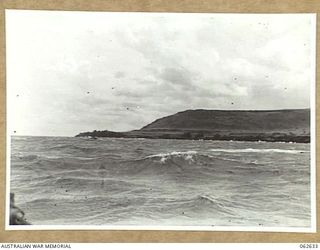 HUBIKI AREA, NEW GUINEA. 1943-12-29. THE COASTLINE NORTH OF HUBIKA SHOWING THE SOWI RIVER, WITH FORTIFICATION HILL IN THE BACKGROUND