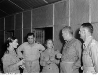 RABAUL, NEW BRITAIN. 1945-12-28. THE PRIME MINISTER OF AUSTRALIA, MR BEN CHIFLEY, ARRIVED BY PLANE TO VISIT MANY OF THE UNITS IN THE AREA. AT THE OPENING OF THE SISTERS' MESS AT THE 118TH ..