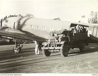 TOROKINA, BOUGAINVILLE ISLAND. 1945-01-30. PERSONNEL OF THE SOLOMON'S DETACHMENT, 12TH AIR MAINTENANCE PLATOON (TS), 4TH BASE SUB AREA, LOADING SUPPLIES INTO AN AIRCRAFT FOR DROPPING TO THE TROOPS ..