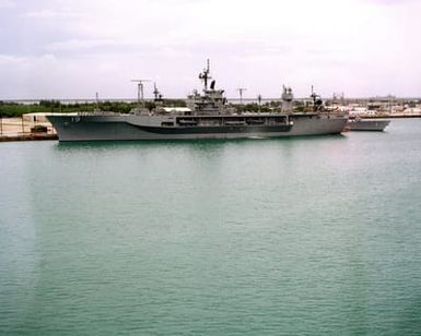 A port beam view of the amphibious command ship USS BLUE RIDGE (LCC 19) moored at the US Naval Ship Repair Facility