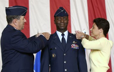 U. S. Air Force Commander of Pacific Air Forces GEN. Paul V. Hester, along with Mrs. Teresa Rice, pin a second star on MAJ. GEN. Edward A. Rice Jr., at Anderson Air Force Base, Guam, on Jan. 25, 2005. (U. S. Air Force PHOTO by STAFF SGT. Bennie J. Davis III) (Released)