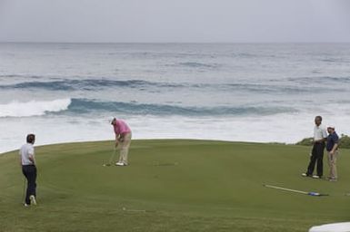 Barack Obama plays golf with Prime Minister Najib Razak, Joe Paulsen, and Mike Brush in Kaneohe Bay, Hawaii, December 24, 2014