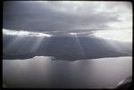 Milne Bay, aerial view of unidentified coastline, small bay, and hills