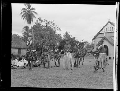 Boys performing a spear dance at the meke, Vuda village, Fiji