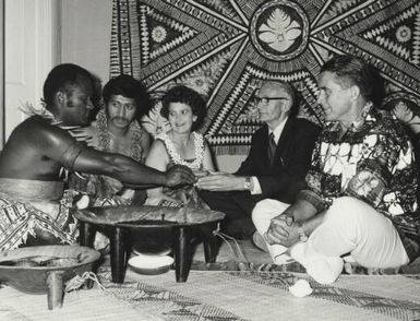 Eparama Ketedromo in national costume, Robin Mitchell, Mrs Ketedromo, Reverend Douglas Telfar and Fred Jordon having traditional kava at a meeting, Adelaide, South Australia, 14 October 1972