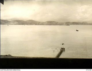 Port Moresby, New Guinea. 1944-04-15. Port Moresby Harbour viewed from a control post overlooking a submarine boom net on the west side of the harbour. The control was constructed by the 8th Army ..