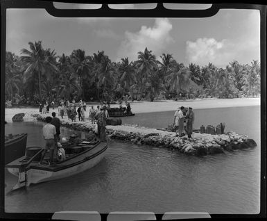 Crew and passengers prepare to be escorted to the TEAL (Tasman Empire Airways Limited) Flying boat, Akaiami, Aitutaki, Cook Islands