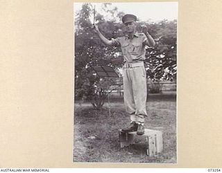 LAE, NEW GUINEA. 1944-05-20. NX190300 WARRANT OFFICER 1, D CRAWLEY, ROYAL PAPUAN CONSTABULARY, (EUROPEAN SECTION). FORMERLY THE BANDMASTER OF THE NEW GUINEA POLICE FORCE, HE IS THE FOUNDER AND ..