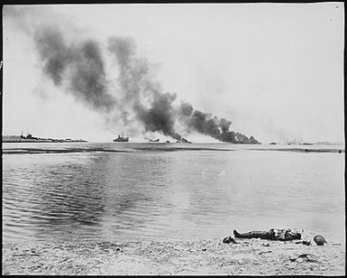 Trapped [Japanese], north of the town of Garapan, attempted to gain refuge by getting to their few ships in Tanapag harbor. On the beach is one [Japanese] who didn't make the boat. Saipan, July 5, 1944.