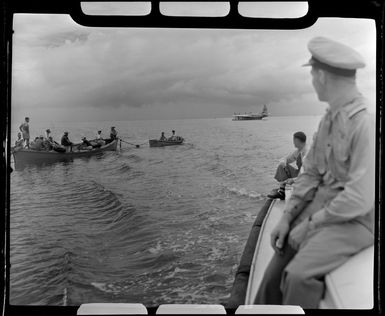 Unidentified passengers from the TEAL (Tasman Empire Airways Limited) ZK-AMM flying boat as they approach Satupuala Base, Samoa