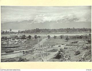 LAE. NEW GUINEA. 1944-07. ONE OF A NUMBER OF PHOTOGRAPHS TAKEN TO GIVE A 120 PANORAMIC VIEW OF THE TOWN OF LAE. TO JOIN TO PHOTOGRAPHS NO. 74635, 74636, 74637, 74638 AND 74640