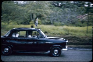 HRH Prince Philip and the District Administrator near the Markham Bridge en route to a sing-sing in his honour at Lae, 1956 / Tom Meigan