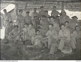 VIVIGANI, GOODENOUGH ISLAND, PAPUA NEW GUINEA. 1943-10-12. GROUP PORTRAIT OF BEAUFIGHTER AIRCREW OF NO. 30 SQUADRON RAAF IN THE STRIP OPERATIONS ROOM TOGETHER AFTER THEY FOUGHT OFF JAPANESE ZERO ..