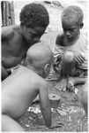 Young boys playing dice