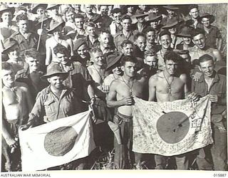 1943-10-01. NEW GUINEA. ATTACK ON KAIAPIT. SOME OF THE AUSTRALIANS WHO TOOK PART IN THE KAIAPIT ACTION, PHOTOGRAPHED AT KAIAPIT VILLAGE. (NEGATIVE BY MILITARY HISTORY NEGATIVES)