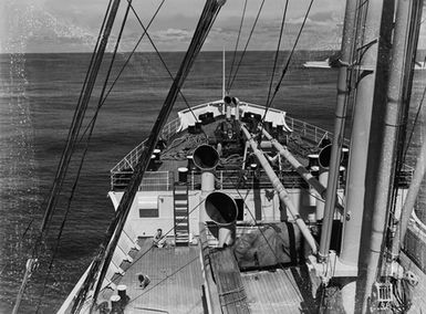 [View looking down onto a deck of a ship and out to sea]