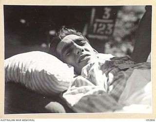 LAE, NEW GUINEA. 1945-06-09. SIGNALMAN S.R. SENIOR (1), BEING MOVED FROM WARD TO AMBULANCE AT 2/7 GENERAL HOSPITAL FOR TRANSFER TO THE HOSPITAL SHIP MANUNDA