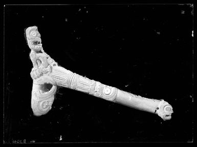 [Carved adze handle - carved by Nutana]