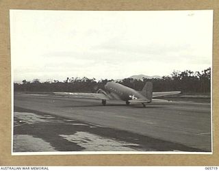 MAREEBA, QLD. 1944-04-10. TAXIING OUT ON THE RUNWAY, THE DOUGLAS C47 AIRCRAFT, MILITARY VERSION OF THE DC3 AIRLINER, "IRENE" (CALL SIGN VH-CFB) OF THE UNITED STATES ARMY AIR FORCE, WITH AN ..