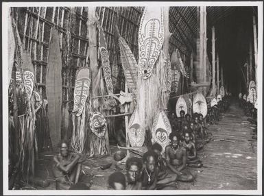 Men in two lines inside the great kau ravi of Kaimari, gulf of Papua, New Guinea, ca. 1920s / Frank Hurley