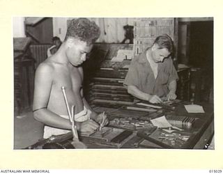 1943-06-18. NEW GUINEA. NEWSPAPERS PUBLISHED BY THE ARMY ARE ONE OF THE MOST POPULAR AMENITIES FOR THE TROOPS. HERE ARE TWO OPERATORS ON THE JOB - HENIHENI OF HAGNAUBADA, PAPUA, AND PTE. R. MILLER, ..