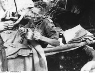 SHAGGY RIDGE, NEW GUINEA. 1943-12-27. WX4356 WARRANT OFFICER II G. E. MORRIS, MM., ED., OF THE 2/16TH AUSTRALIAN INFANTRY BATTALION, 21ST AUSTRALIAN INFANTRY BRIGADE WHO WAS WOUNDED IN THE ATTACK ..