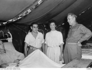 RABAUL, NEW BRITAIN. 1945-12-28. THE PRIME MINISTER OF AUSTRALIA, MR BEN CHIFLEY, ARRIVED BY PLANE TO VISIT MANY OF THE UNITS IN THE AREA. MR CHIFLEY TALKED WITH SOME OF THE PATIENTS IN ONE OF THE ..