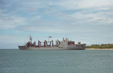 A port view of the replenishment oiler USS KANSAS CITY (AOR 3) departing Pearl Harbor through the channel.