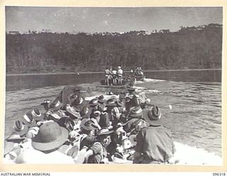 SIMPSON HARBOUR, RABAUL, NEW BRITAIN. 1945-09-10. TROOPS OF 29/46 INFANTRY BATTALION, 4 INFANTRY BRIGADE, PART OF THE RABAUL OCCUPATIONAL FORCE, MOVING TOWARDS THE SHORE ABOUT THREE MILES FROM ..