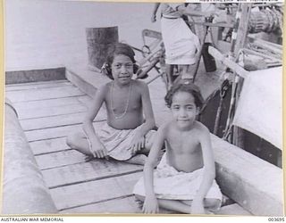 PORT MORESBY - NATIVE GIRLS - AGED ABOUT 8 AND 5 YEARS. RAAF SURVEY FLIGHT. (NEGATIVE BY N. TRACY)