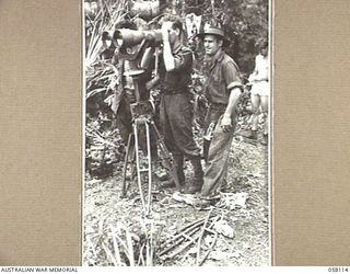 FINSCHHAFEN, NEW GUINEA, 1943-10-02. HUGE PAIR OF JAPANESE BINOCULARS WHICH WERE STILL STANDING IN THE OBSERVATION POST WHEN THE AUSTRALIAN TROOPS OVERRAN THE AREA