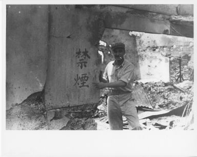 Charles Sims in front of "No Smoking" sign