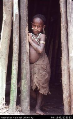 A young Febi girl at the doorway of Bulong longhouse