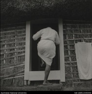 Man in the doorway of a house