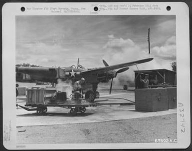 Men Use Steam To Clean A Lockheed P-38 "Lightning" At The Washing Department Of The 27Th Air Depot Group, Port Moresby Port Depot, Papua, New Guinea. (U.S. Air Force Number 67692AC)