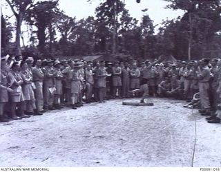 THE SOLOMON ISLANDS, 1945-01-12. THROWING THE HAMMER AT A COMBINED ANZAC SPORTS MEETING AT BOUGAINVILLE ISLAND. (RNZAF OFFICIAL PHOTOGRAPH.)