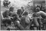 Men eating gwasu taro and coconut pudding